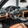 alt = "bmw m4 competition interior"